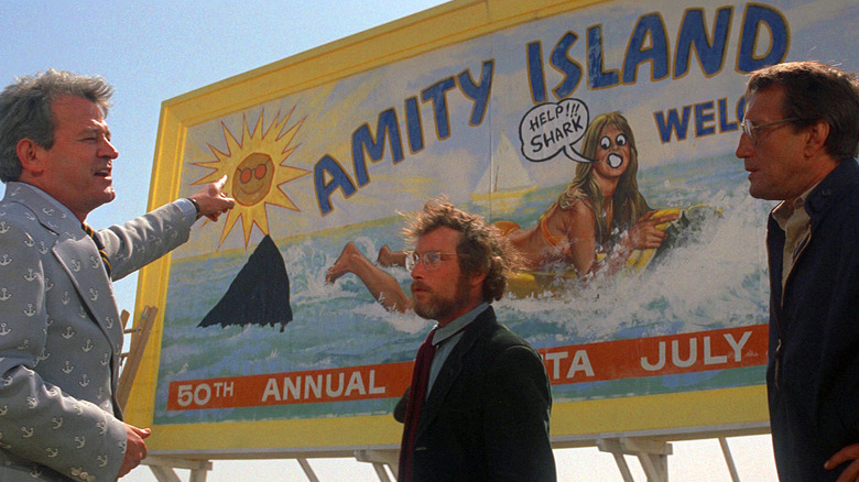 Brody, Vaughn, and Hooper in front of the Amity Island sign in Jaws (1975)