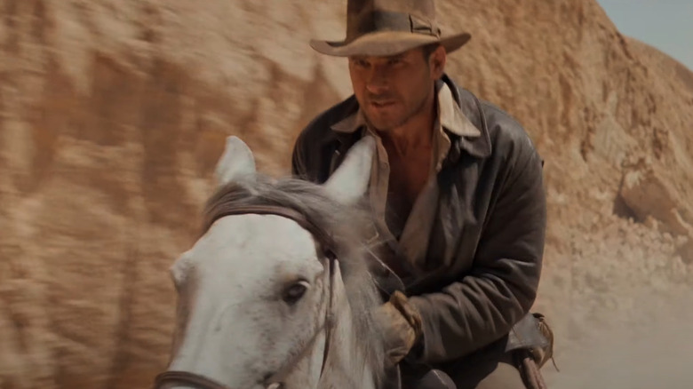 Harrison Ford riding a horse in Raiders of the Lost Ark