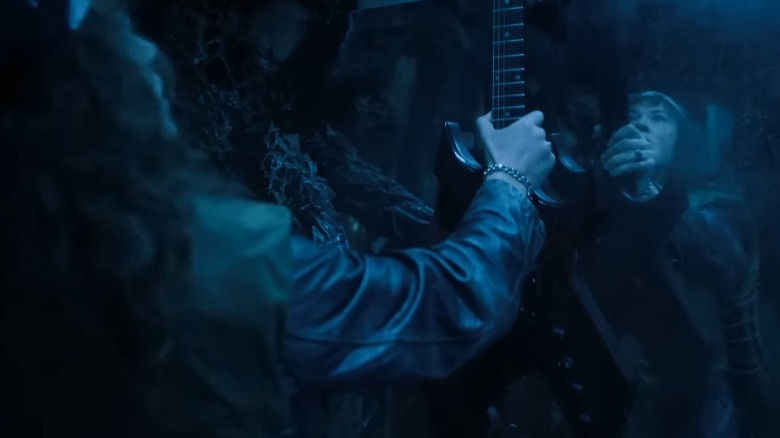 Eddie with his guitar in Stranger Things Volume 2