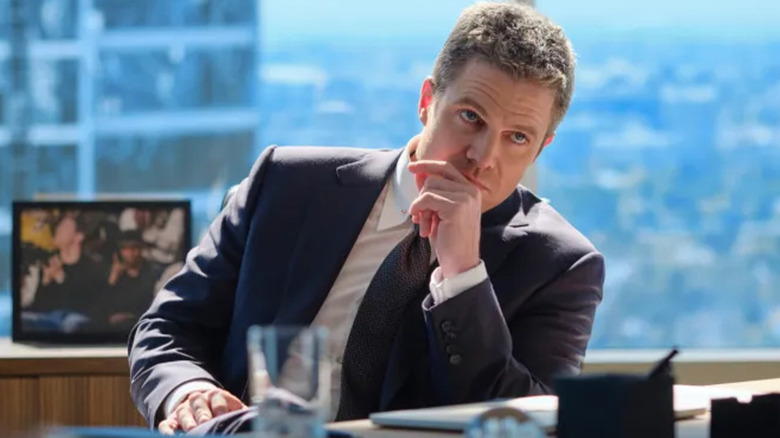 Ted Black sitting at his desk on Suits LA