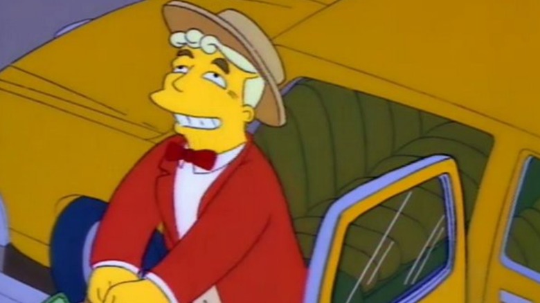 Lyle Laney em Music Man Regalia sorri enquanto entra em um táxi nos Simpsons