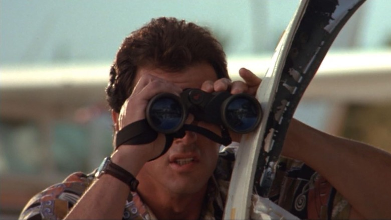 Sylvester Stallone as Joe Bomowski using a pair of binoculars in Stop! Or My Mom Will Shoot