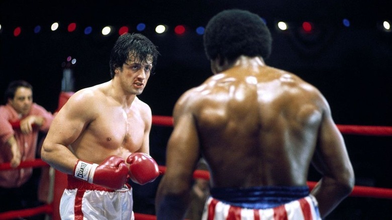 Sylvester Stallone and Carl Weathers as Rocky Balboa and Apollo Creed in Rocky