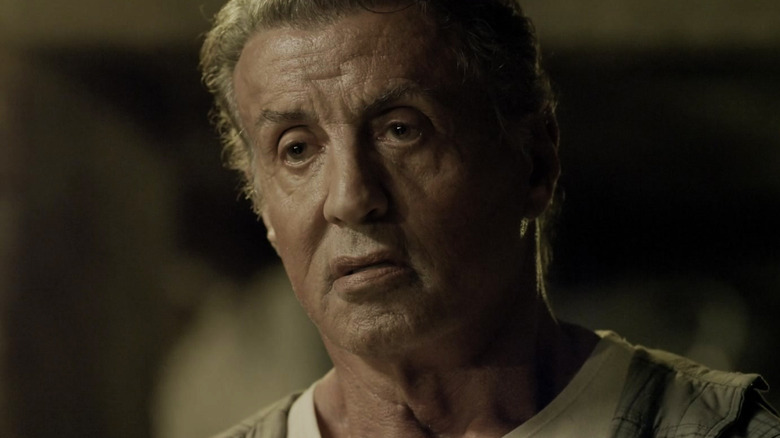 Sylvester Stallone's John Rambo looks across the frame in Rambo: Last Blood