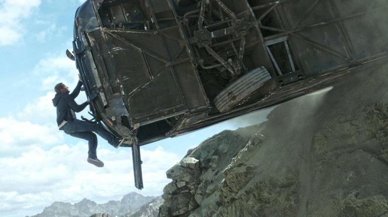 Brian scales a hanging bus in Furious 7