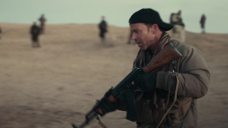 Taylor Sheridan's Field Officer Brian stands in the desert in 12 Strong