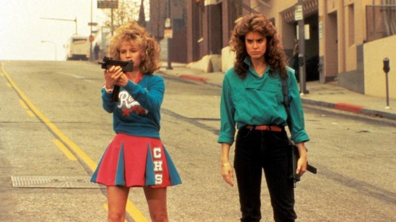 Regina and Samantha with guns on street