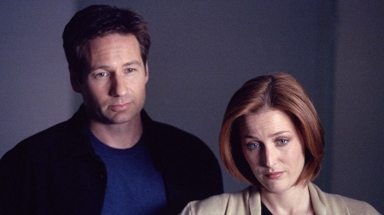 Mulder and Scully stand side-by-side