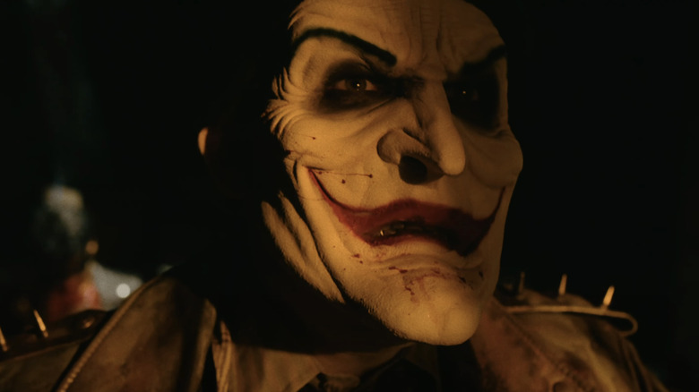 David Howard Thornton's Joker looks into orange light in the fan film Joker's Wild