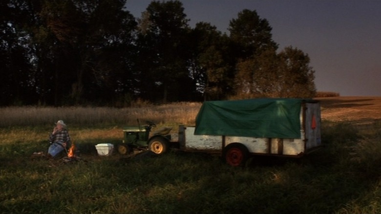 Alvin Straight, resting by the side of the road with his riding mower.