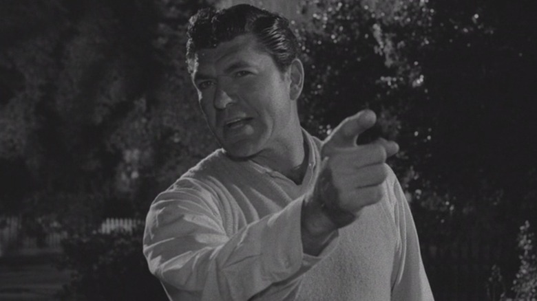 Claude Akins as Steve Brand pointing accusatorily at his neighbors in The Monsters Are Due on Maple Street