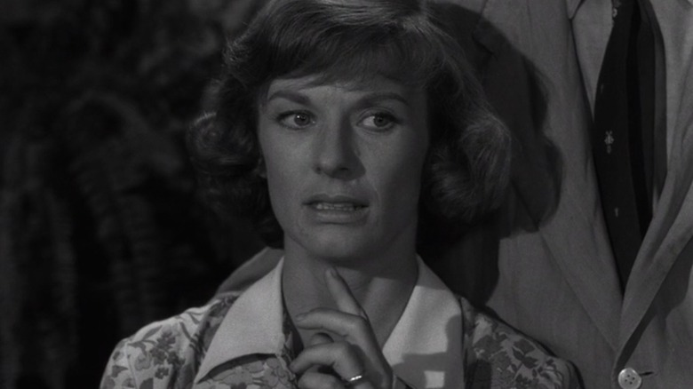 Cloris Leachman as Mrs. Fremont looks uneasy, her hand to her chin, in It's A Good Life