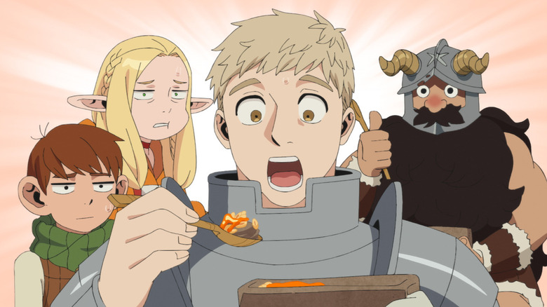 Laios looks amazed at a spoonful of food while Marcille and Chilchuck stare in disbelief and Senshi gives a thumbs up in Delicious in Dungeon