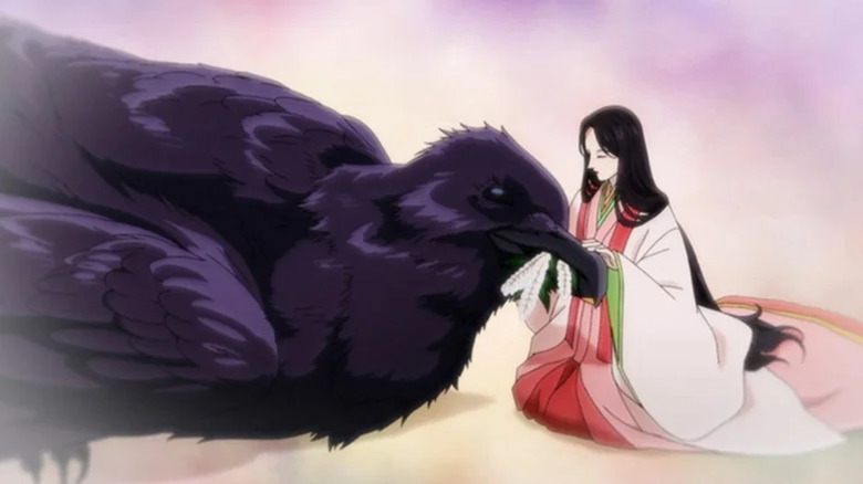 Wakamiya petting a giant raven in Yatagarasu: The Raven Does Not Choose Its Master