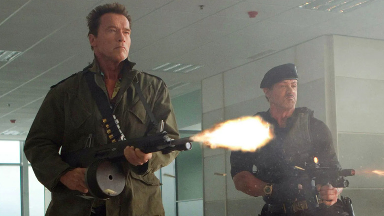 The Expendables' Arnold Schwarzenegger and Sylvester Stallone firing machine guns