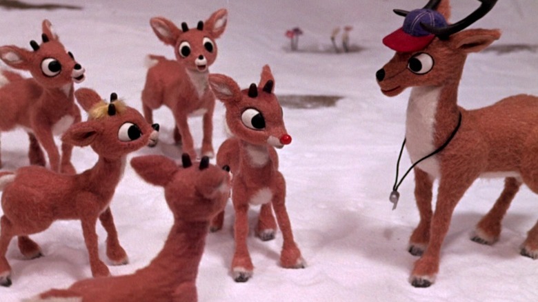 A group of Reindeer and Comet staring at Rudolph with his exposed red nose in "Rudolph The Red-Nosed Reindeer" (1964)