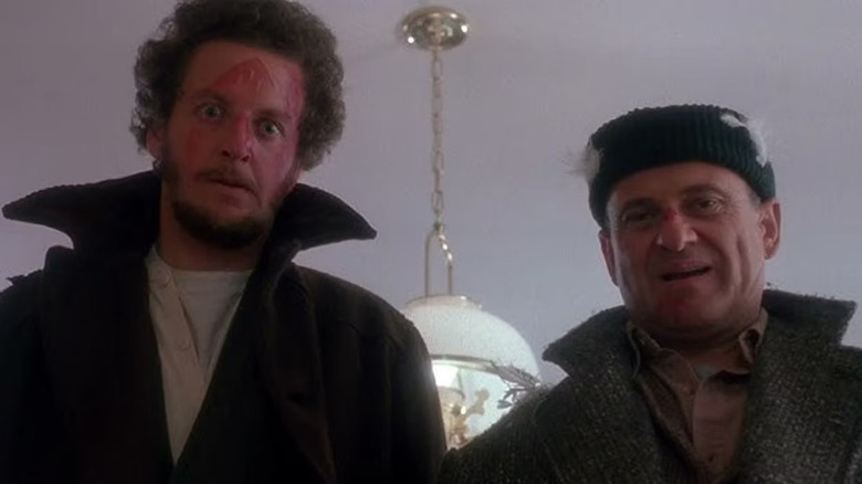 Harry and Marv spitefully staring down in "Home Alone" (1990)