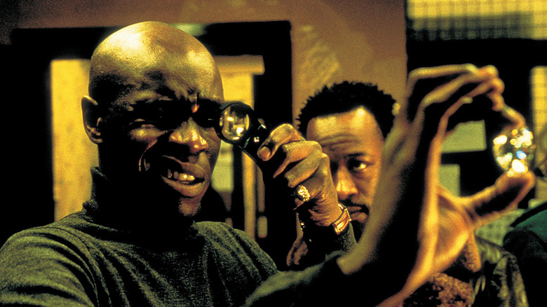 Lennie James and Robbie Gee examining diamond