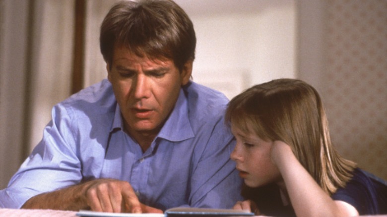 Henry Turners' Harrison Ford reading book with son