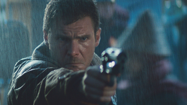 Blade Runner's Deckard aims his pistol