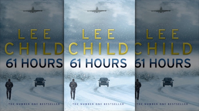 The cover of Jack Reacher: 61 Hours by Lee Child, picturing a snowy road through the woods