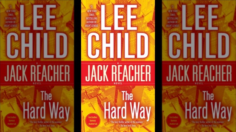 The cover of Jack Reacher: The Hard War by Lee Child, with an orange-tinted view of city buildings from overhead