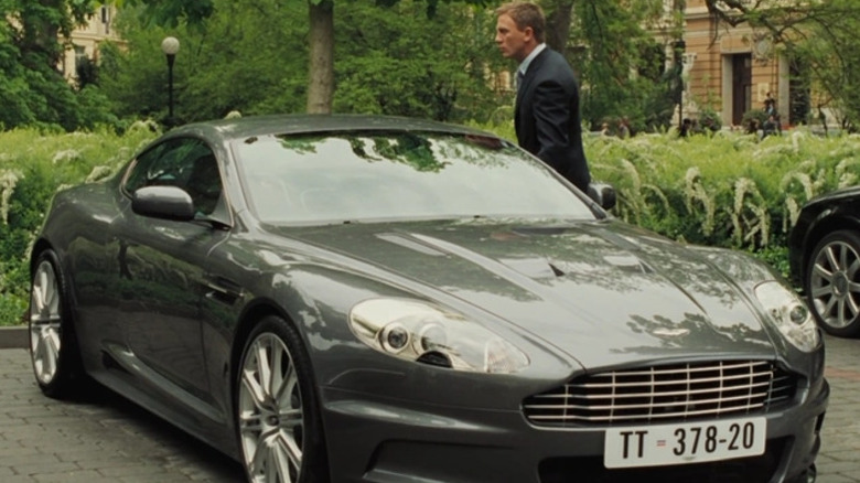 James Bond (Daniel Craig) approaches an Aston Martin DBS V12 in Casino Royale