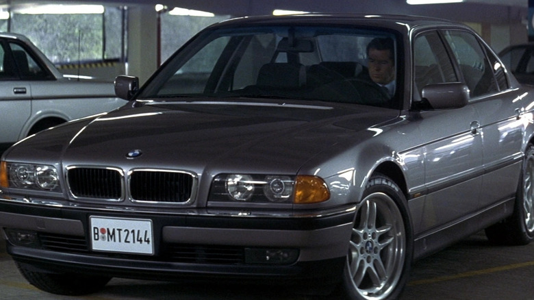 James Bond (Pierce Brosnan) sits in his parked BMW in Tomorrow Never Dies