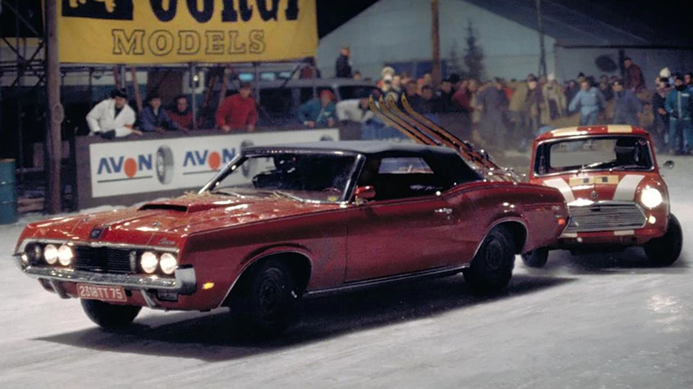 A Mercury Cougar XR-7 in front of a stock race car in On Her Majesty's Secret Service