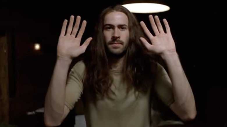 Jason Lee long hair, hands up