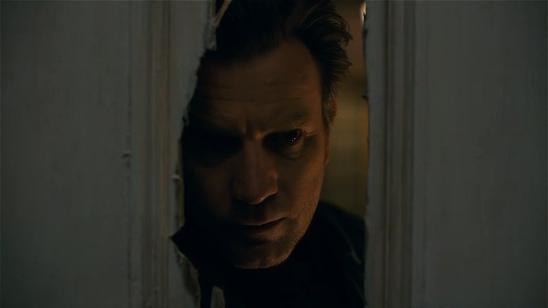 Ewan McGregor looking through door