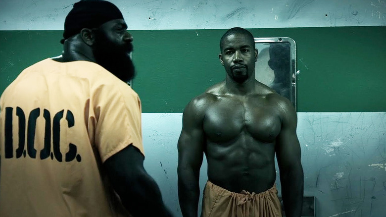 Kimbo Slice and Michael Jai Wait as a prison inmate and Isaiah Bone, squaring off in a prison bathroom in Blood and Bone