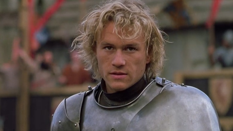 A closeup of Heath Ledger as William Thatcher from A Knight's Tale in his suit of armor and mop of blond hair