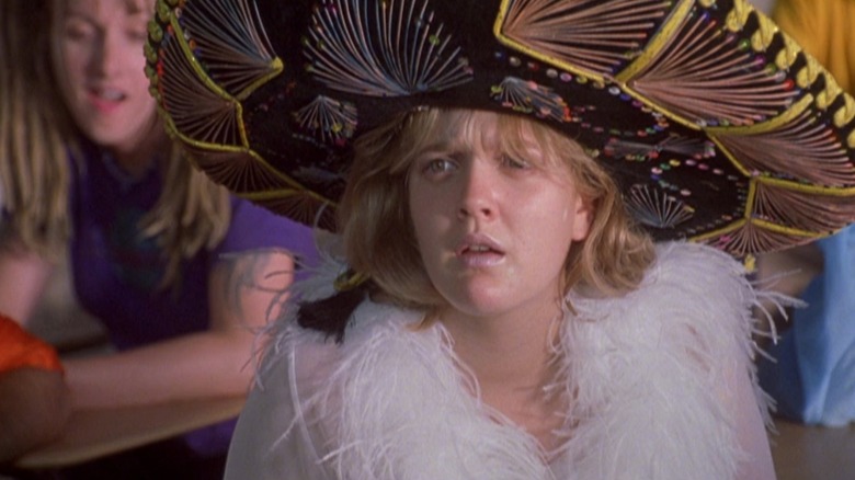 Josie Gellar from "Never Been Kissed," wearing her iconic feather outfit and a giant sombrero