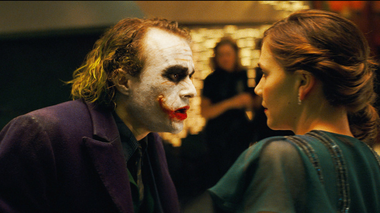 The Joker terrorizes Rachel Dawes in The Dark Knight