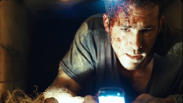 Ryan Reynolds as Paul in Buried, trapped in a coffin