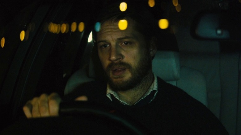 Tom Hardy as Locke in Locke, driving in a city at night