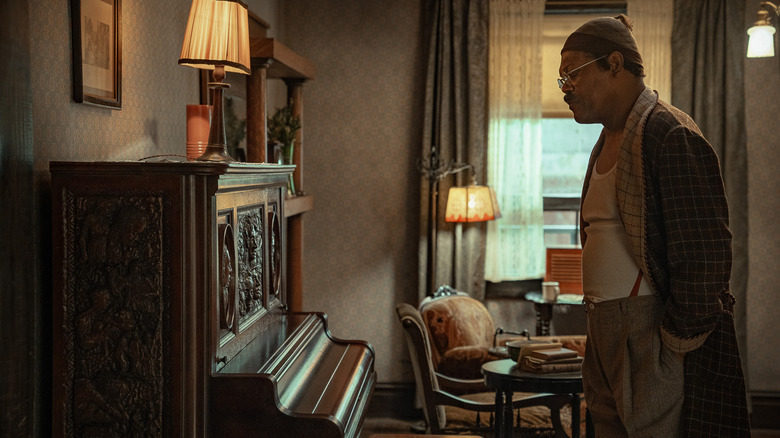 Samuel L. Jackson as Doaker Charles looking at a piano in The Piano Lesson