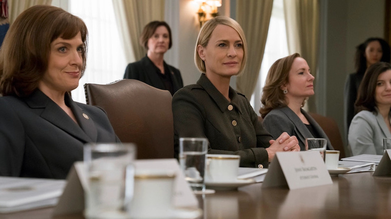 Robin Wright with cabinet sitting House of Cards