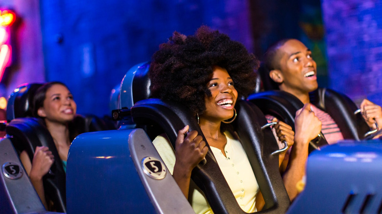 Guests scream as the Rock 'n' Roller Coaster takes flight