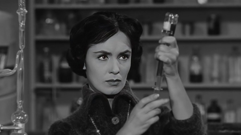 Susan Cabot holding a syringe and vial in The Wasp Woman