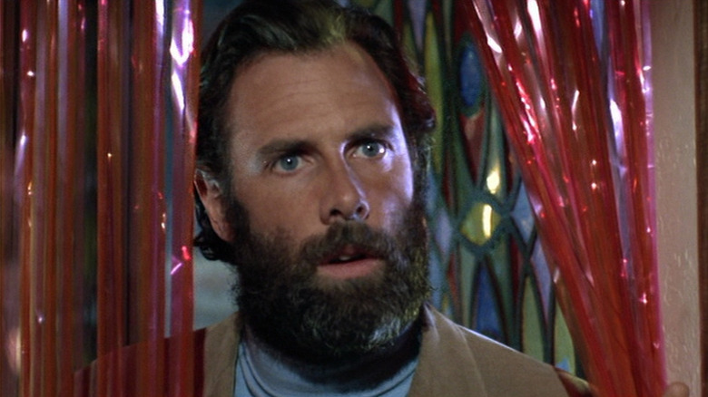 Bruce Dern stands in a plastic curtain in The Trip