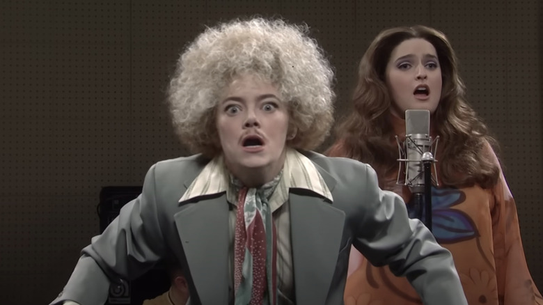 Emma Stone looking crazy in the Make Your Own Kind of Music sketch on SNL