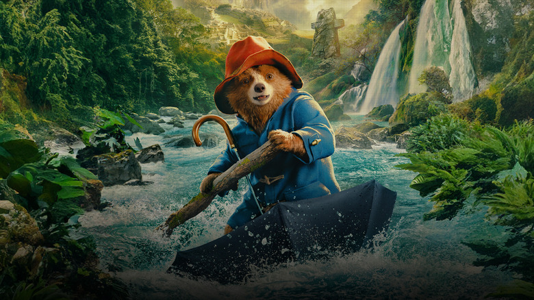 Paddington Bear rowing down a river while sitting in an umbrella, looking happy in Paddington in Peru