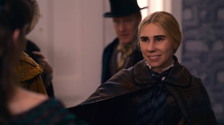 Louisa May Alcott smiling on Dickinson