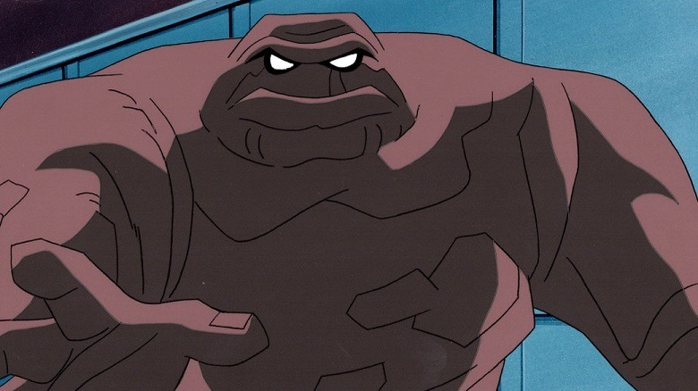 Clayface stretches out a grabbing hand