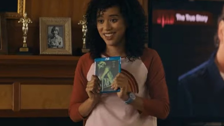 Mindy holding Stab on Blu-ray