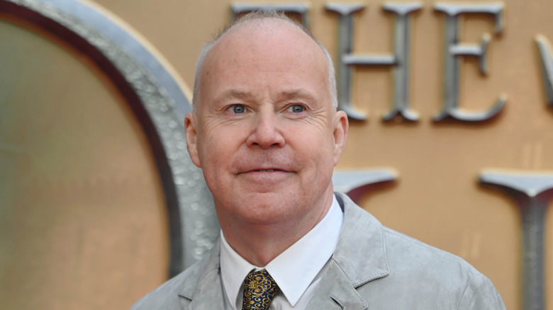 David Yates in grey jacket and yellow tie