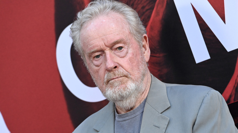 Ridley Scott in grey jacket