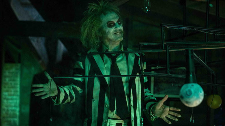 Michael Keaton's Beetlejuice emerging in the attic in Beetlejuice Beetlejuice